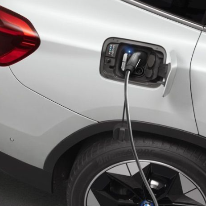 An image depicts an electric vehicle (EV) charging, utilizing the Aposol charging cable plugged into the car's port. Another image provides a front and side view of a portable EV charger control box with dimensions labeled, showcasing Aposol's dedication to renewable energy solutions.